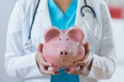 doctor holding out piggy bank