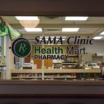View of clinic staff through SAMA clinic Health Mart Pharmacy window